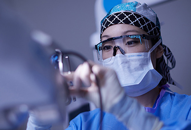 UMC nurse adjusting a medical device