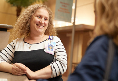 UMC visitor talking to a doctor smiling