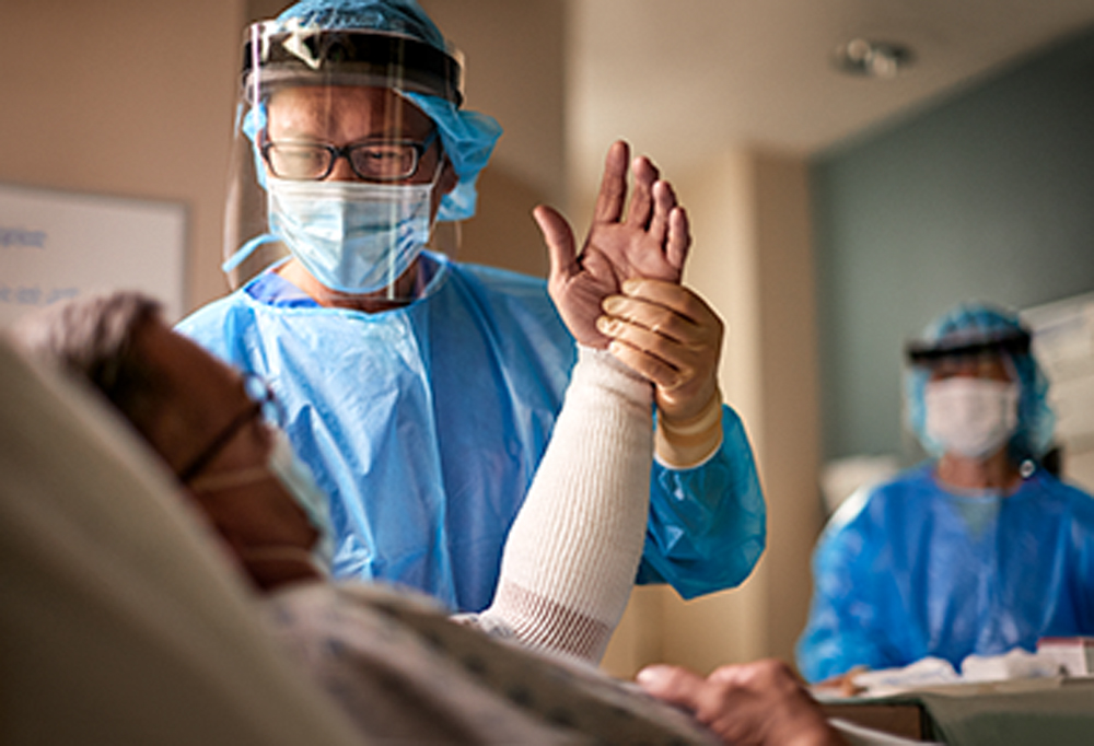 UMC Lions Burn Care Center doctor tending to patient