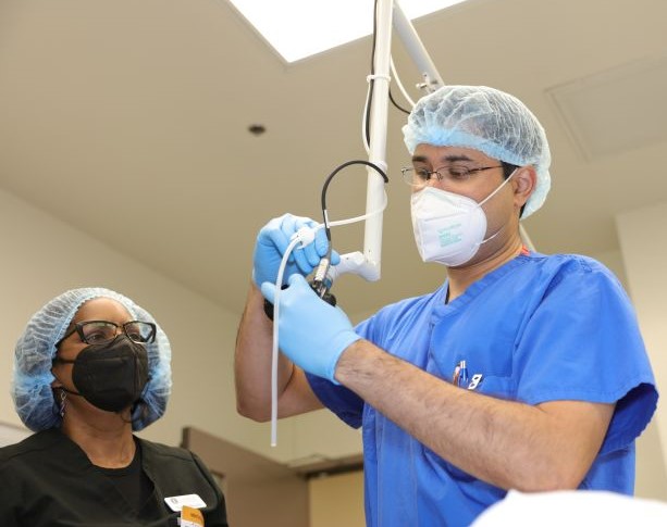 UMC doctor and nurse connecting medical device