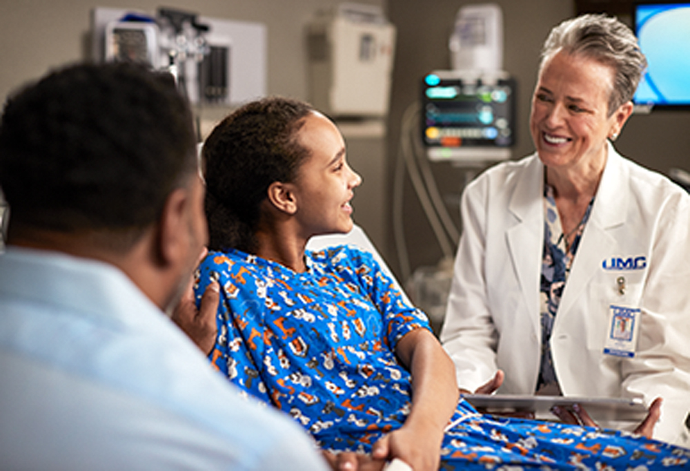 UMC Children's Hospital physician with family